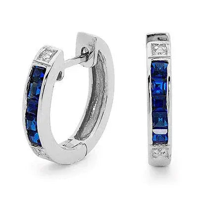 Sterling silver huggie hoop earrings set with cubic zirconia and blue sapphire by Giulia's Secret