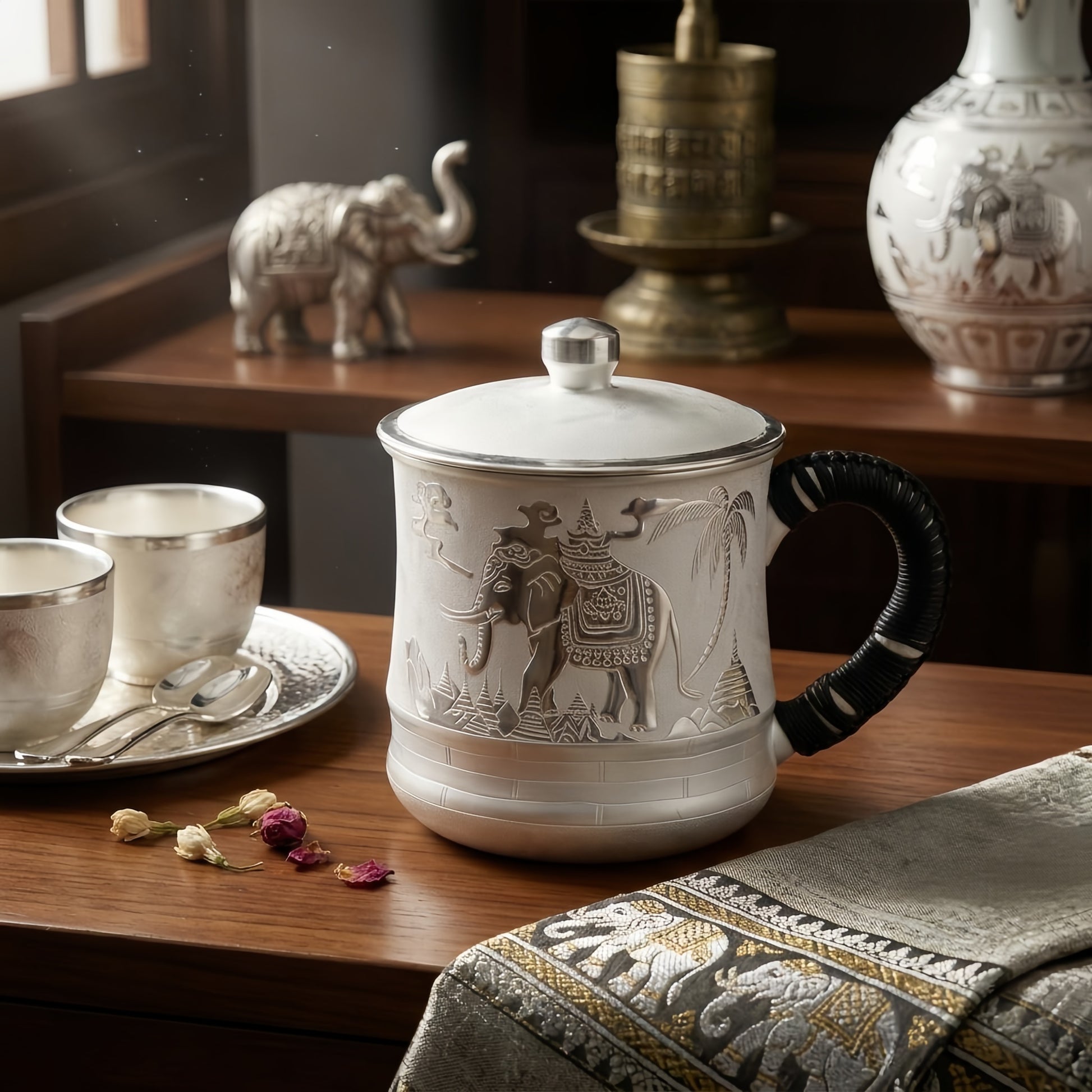 Engraved elephant bearing a tiered temple with palm trees on the porcelain mug