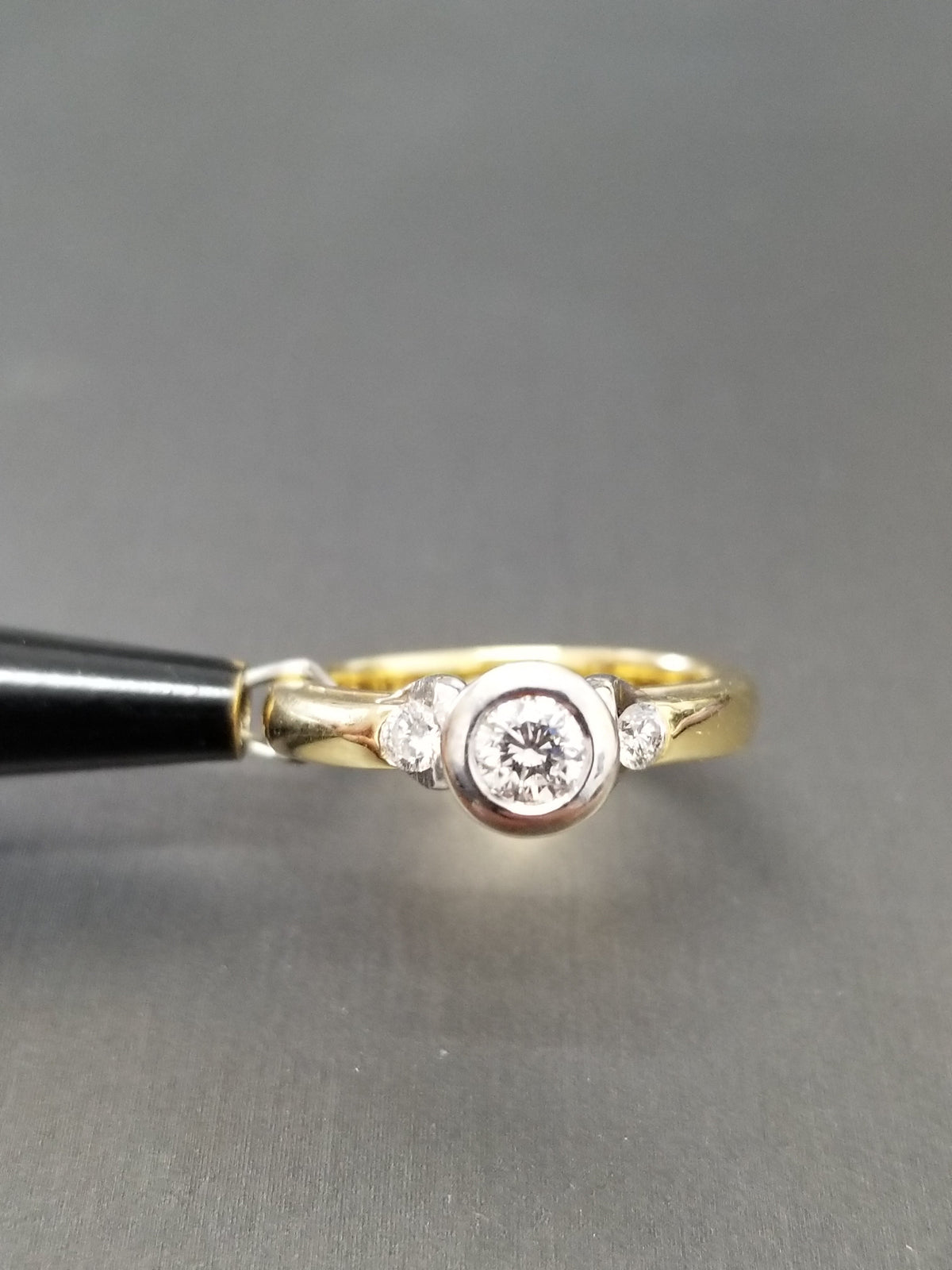 Natural Diamond Bezel Trilogy engagement ring, side profile