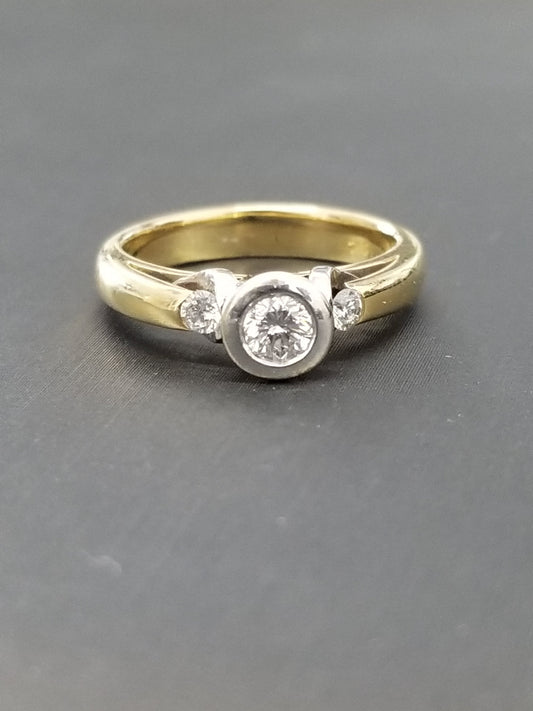 Natural Diamond Bezel Trilogy ring - 18ct yellow gold band with white gold bezel setting, front view